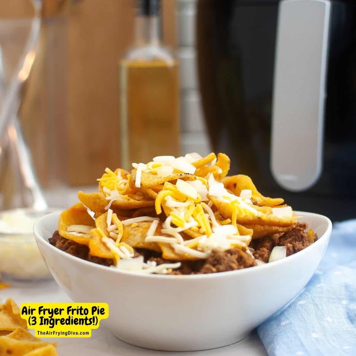 Air Fryer Frito Pie ( just 3 ingredients!), a simple and delicious meal or appetizer recipe made with corn chips, chili, and cheese. 