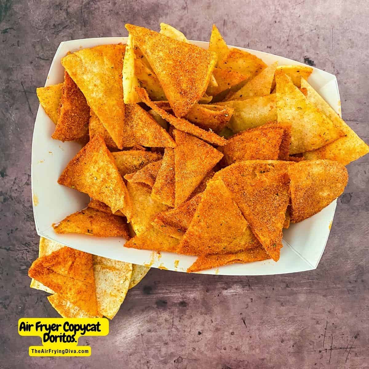 Air Fryer Copycat Doritos, a simple and delicious snack recipe made with tortillas and seasoned with nacho seasoning.