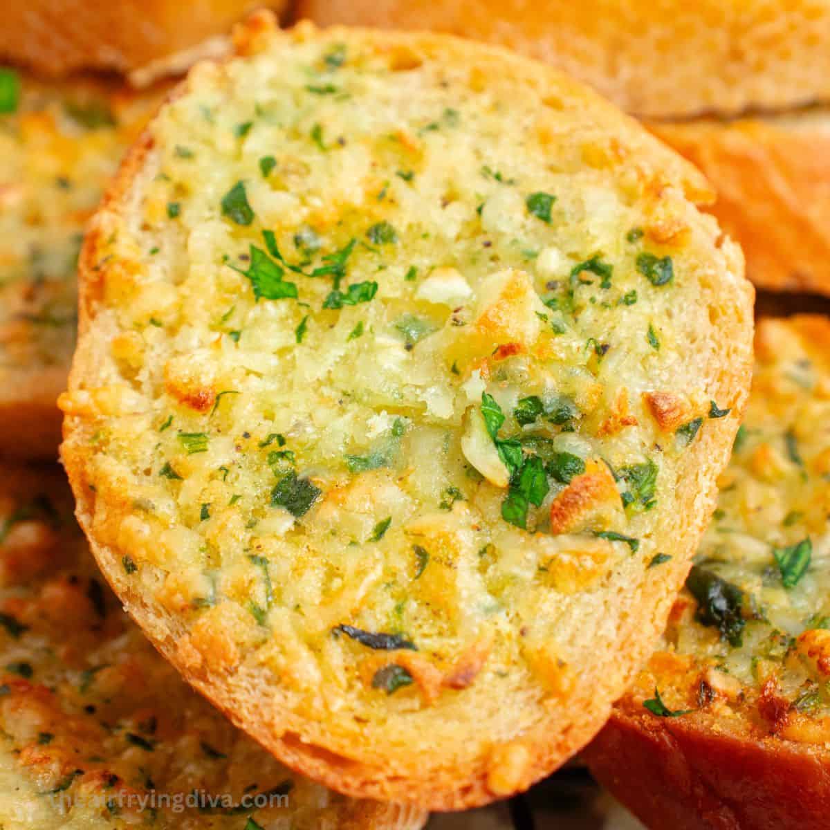 Air Fryer Garlic Bread, a quick and easy appetizer, snack, or side recipe for crispy bread loaded with bubbling butter with garlic.