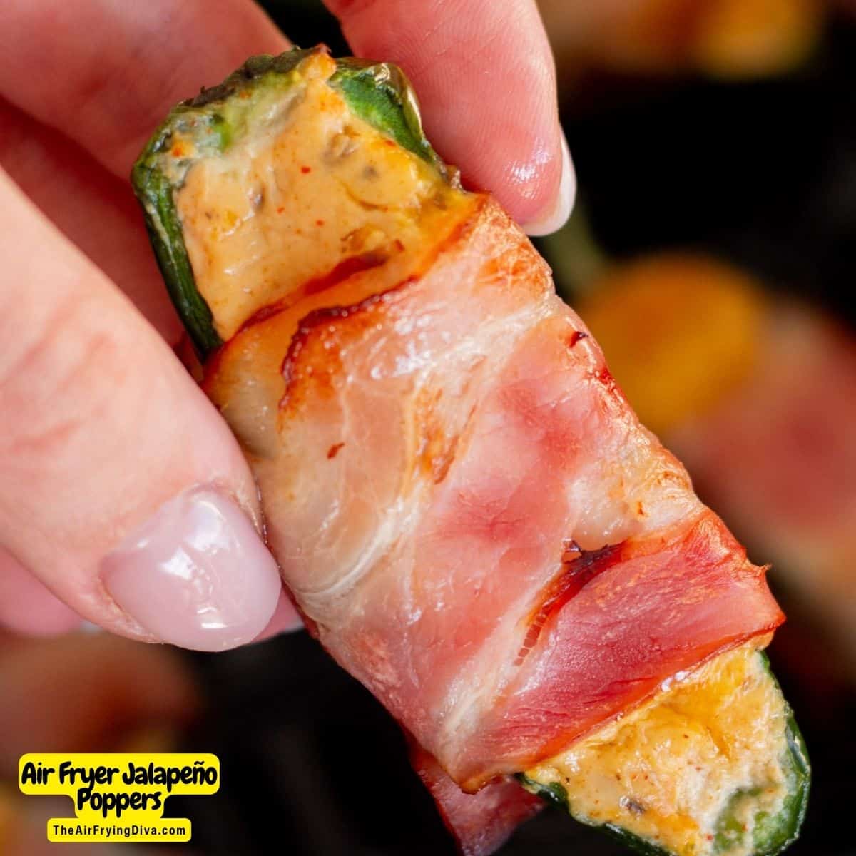 Air Fryer Jalapeno Poppers, a delicious appetizer or snack recipe featuring cheese stuffed peppers wrapped in bacon served warm.