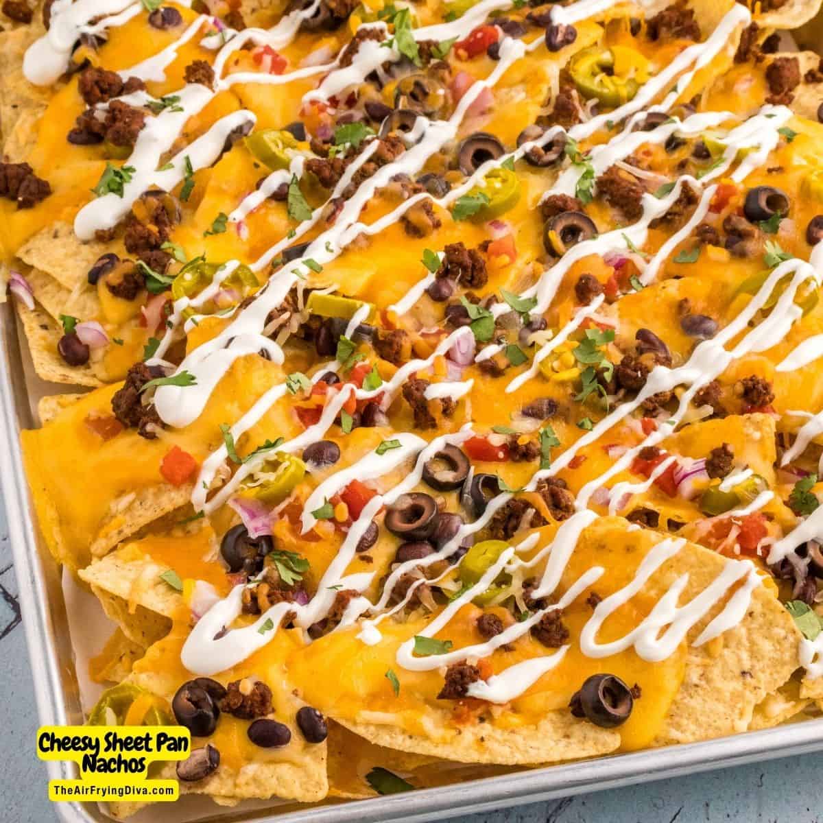 Cheesy Sheet Pan Nachos, a delicious recipe for loaded nachos baked on a sheet pan and topped with a creamy homemade cheese sauce.