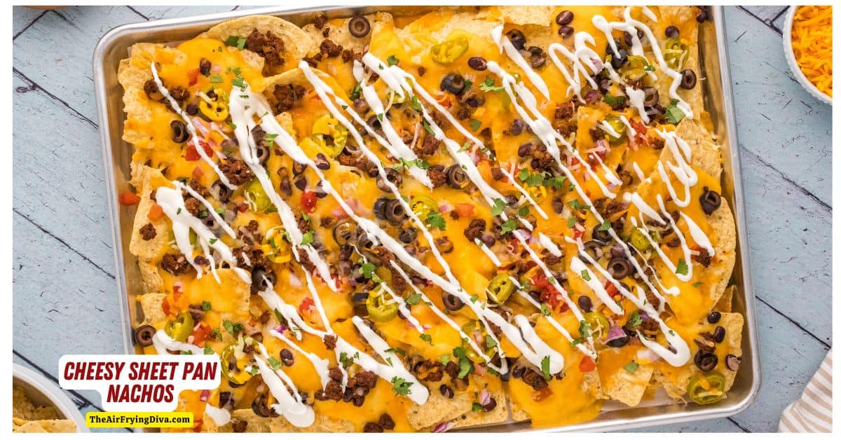 Cheesy Sheet Pan Nachos, a delicious recipe for loaded nachos baked on a sheet pan and topped with a creamy homemade cheese sauce.