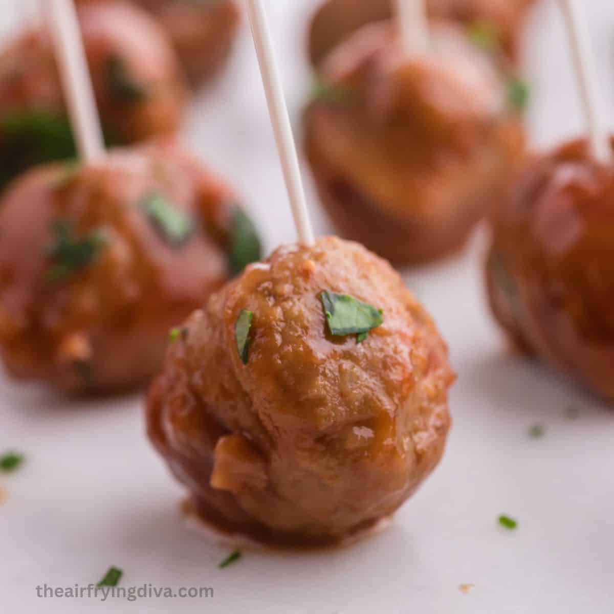  Crockpot Cranberry Barbecue Meatballs, a simple appetizer or party recipe made with cranberry sauce and slow cooked to perfection. 