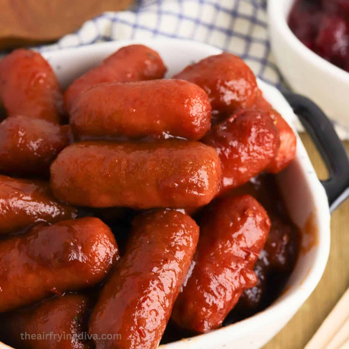 Crockpot Cranberry Chili Cocktail Sausages, a simple and delicious three ingredient appetizer recipe slow cooked to perfection.