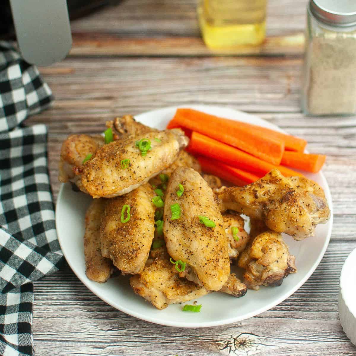 Air Fryer Crispy Chicken Wings, a simple three ingredient recipe for moist and juicy chicken cooked to perfection