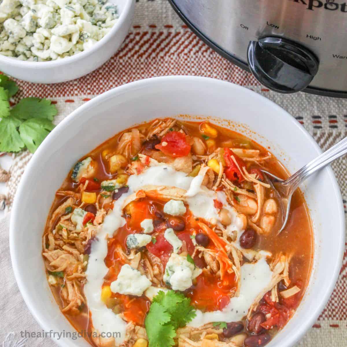 Crockpot Buffalo Chicken Chili, an easy and delicious made with beans and fire roasted tomatoes slow cooked to perfection.