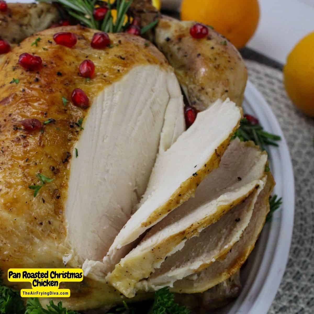 Pan Roasted Christmas Chicken Recipe, a moist and tender oven baked whole chicken flavored with orange slices and rosemary.