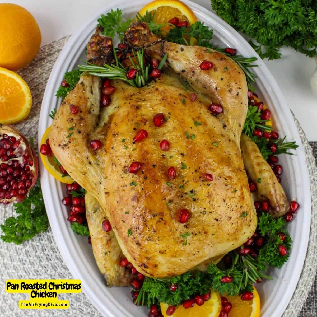 Pan Roasted Christmas Chicken Recipe, a moist and tender oven baked whole chicken flavored with orange slices and rosemary.