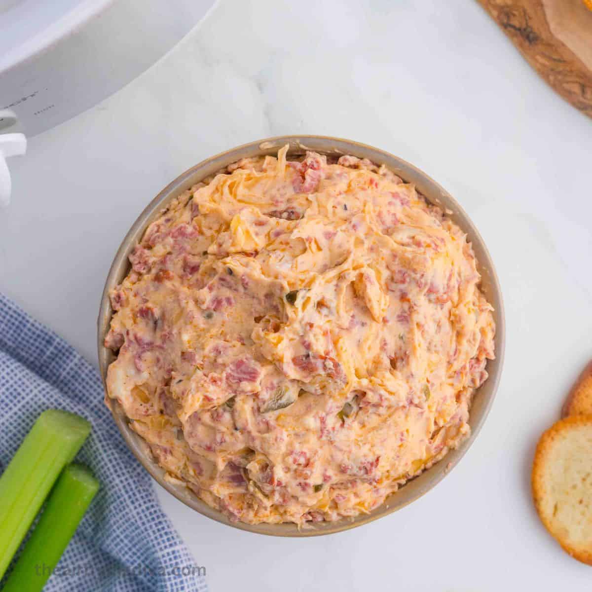 Easy Crockpot Reuben Dip Recipe, a delicious cheesy and savory warm appetizer recipe that is perfect for parties and game day gatherings.