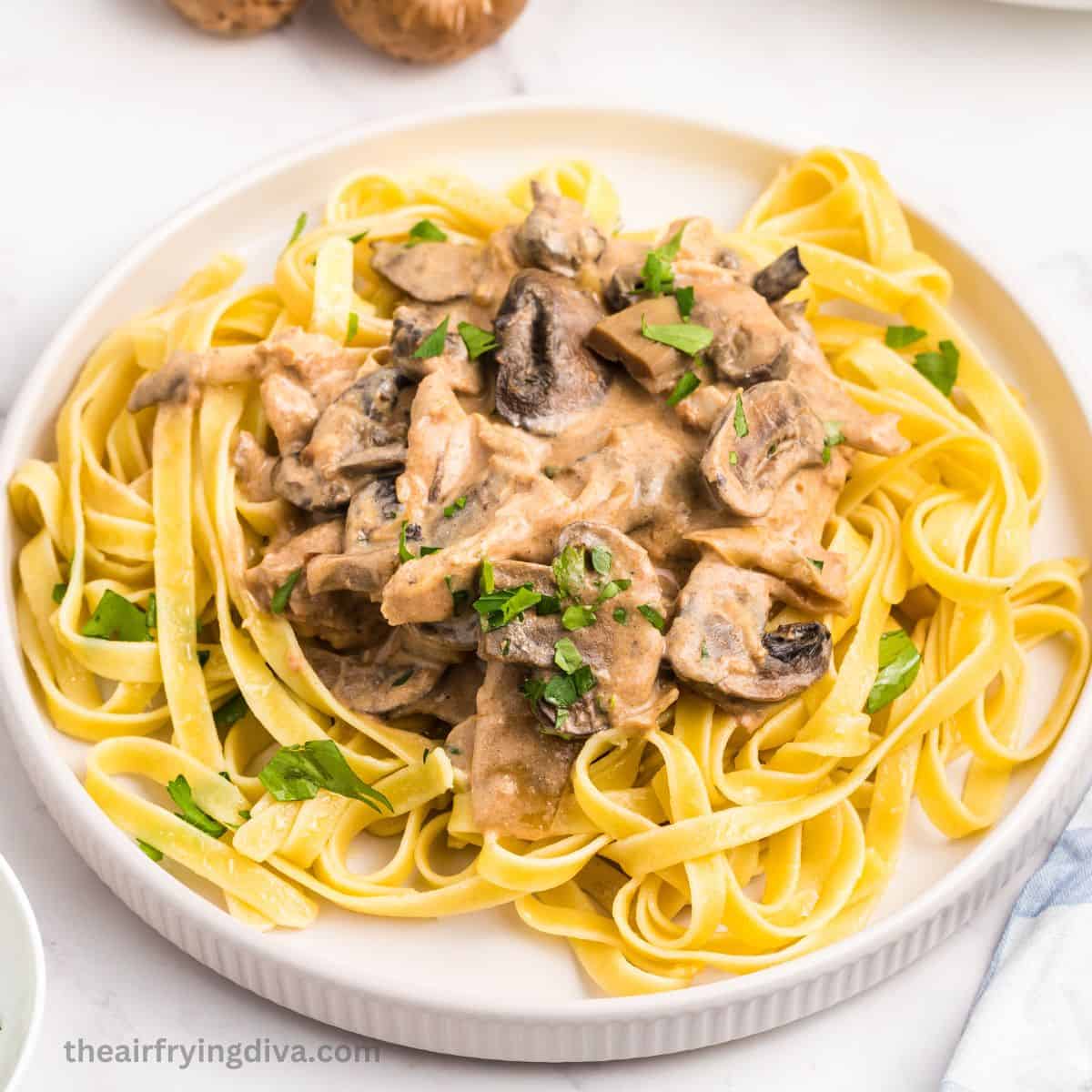 Slow Cooker Chicken Stroganoff, an easy crock pot recipe for a hearty and comforting dish featuring chicken breast in creamy sauce. 