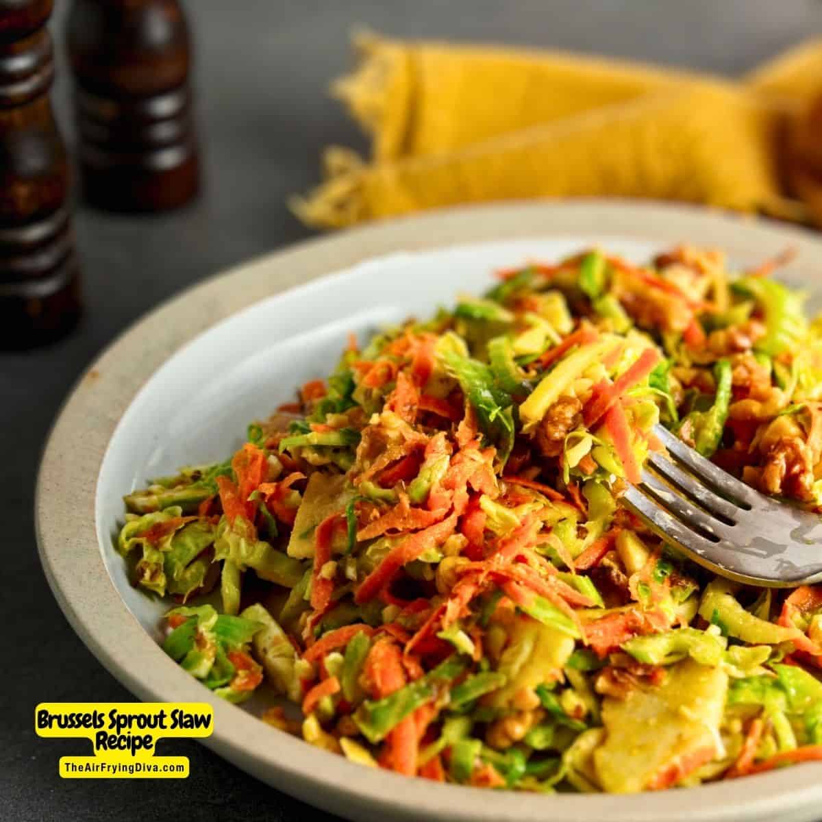 Brussels Sprout Slaw Recipe, a quick and simple side or appetizer recipe made with apple and carrot in a maple vinaigrette dressing.
