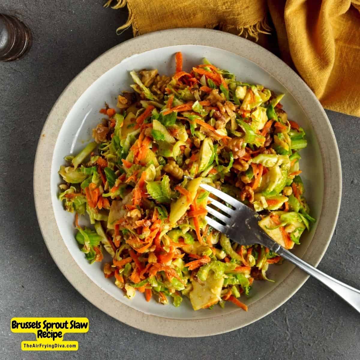 Brussels Sprout Slaw Recipe, a quick and simple side or appetizer recipe made with apple and carrot in a maple vinaigrette dressing.