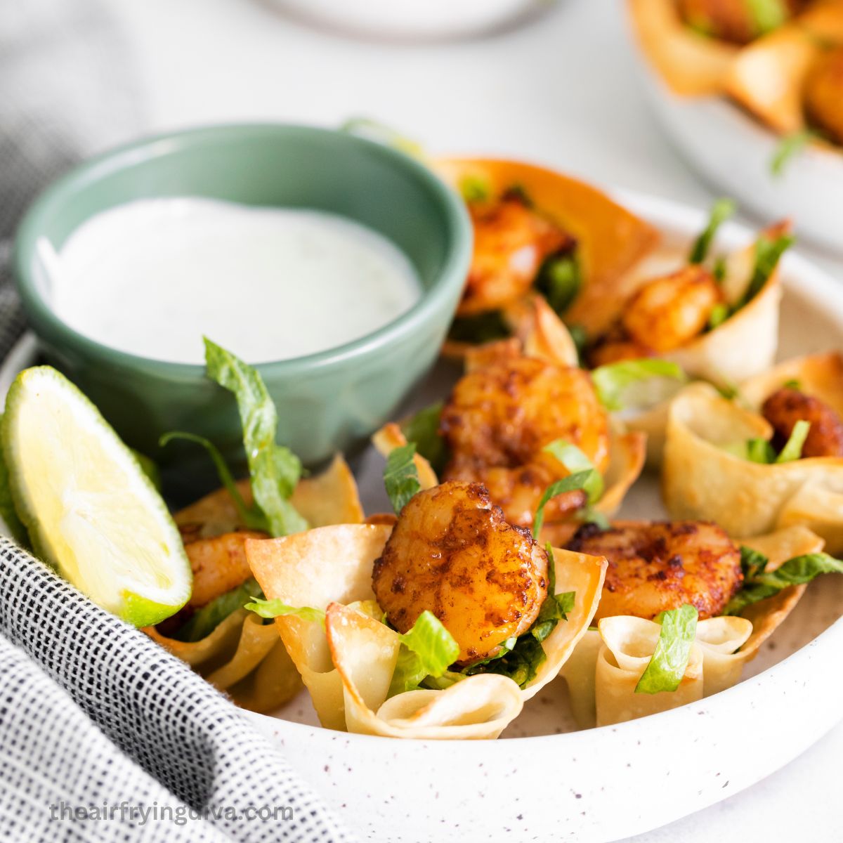 Shrimp Taco Bites with Lime Crema, a delicious appetizer recipe made in about 20 minutes and served in a creamy lime flavored dip.