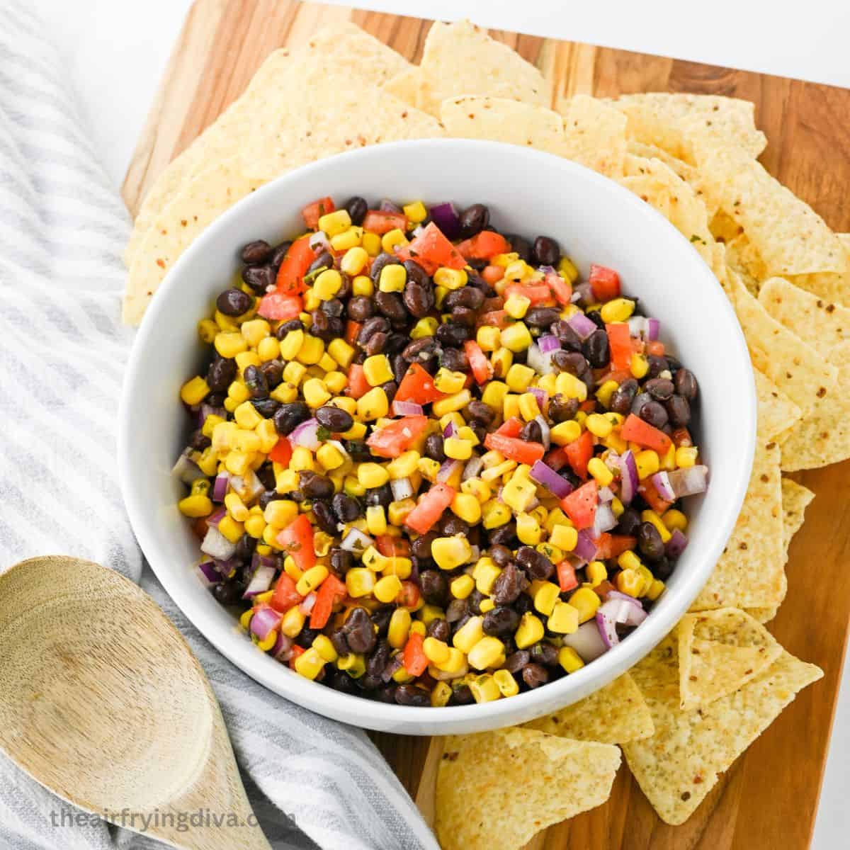 Easy Black Bean Salsa Recipe, a simple side dish recipe or appetizer dip made with corn and tomatoes in about 10 minutes.