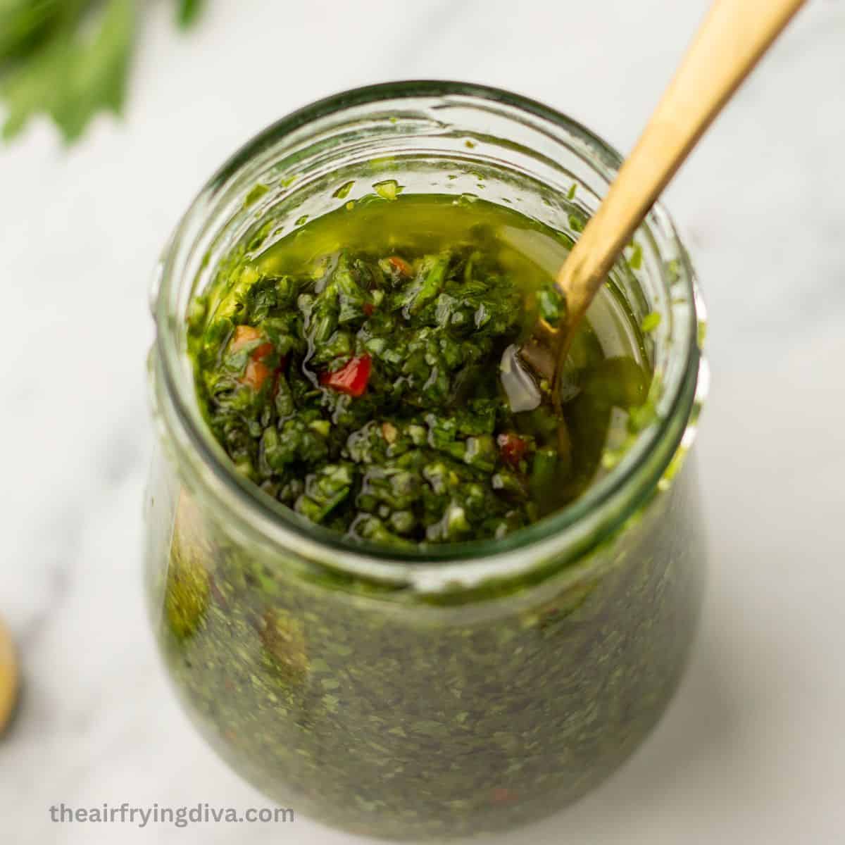 Easy Chimichurri Sauce Recipe, a simple 10 minute condiment or sauce recipe made with fresh ingredients in a garlicky vinaigrette.