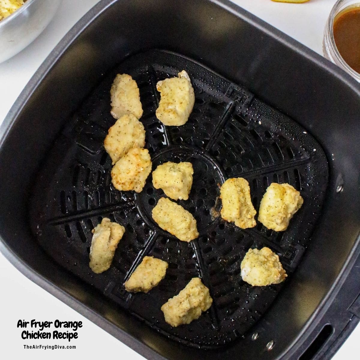 Air Fryer Orange Chicken Recipe, a delicious recipe for chicken breast bites air fried to perfection and served in a sweet and tangy sauce.