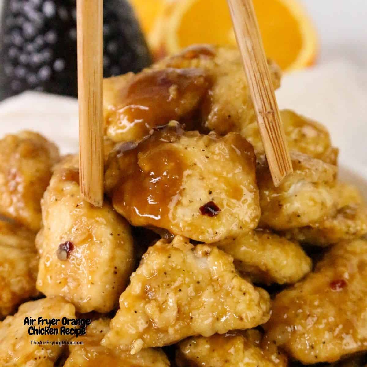 Air Fryer Orange Chicken Recipe, a delicious recipe for chicken breast bites air fried to perfection and served in a sweet and tangy sauce.