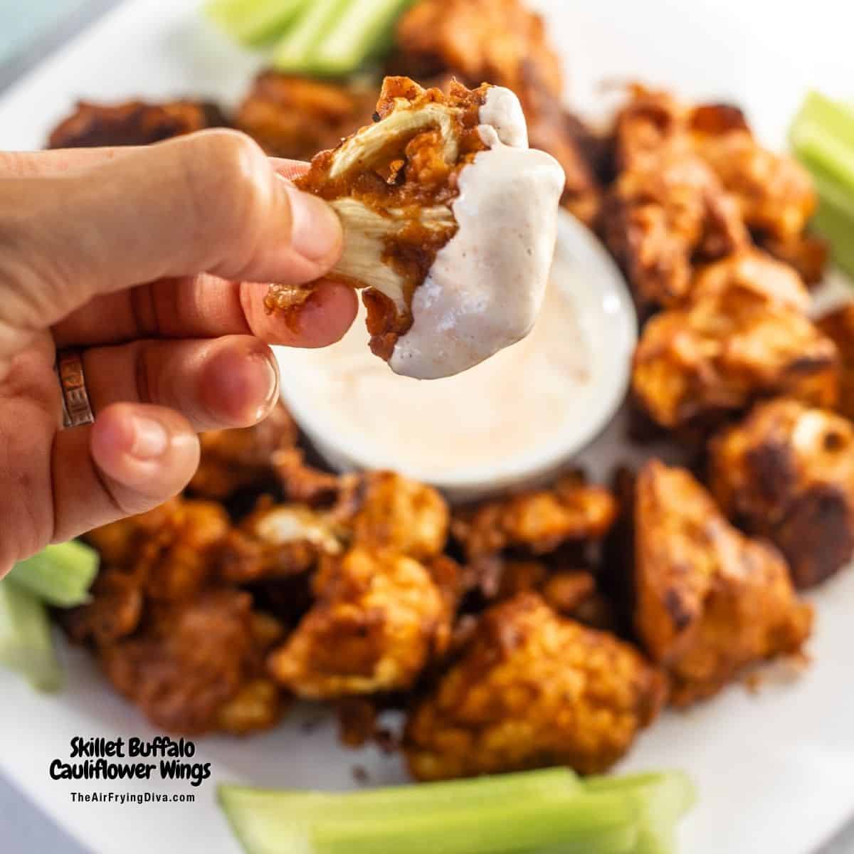 Skillet Buffalo Cauliflower Wings, lightly breaded cauliflower perfectly cooked crisp in a cast iron skillet and coated in buffalo sauce.