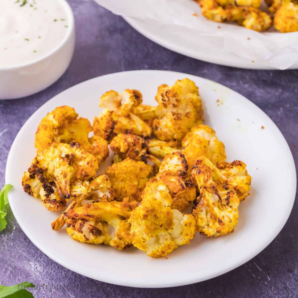 Crispy Air Fryer Cauliflower, a quick and simple healthy appetizer or side made with seasoned cauliflower air fried to perfection. Vegan.
