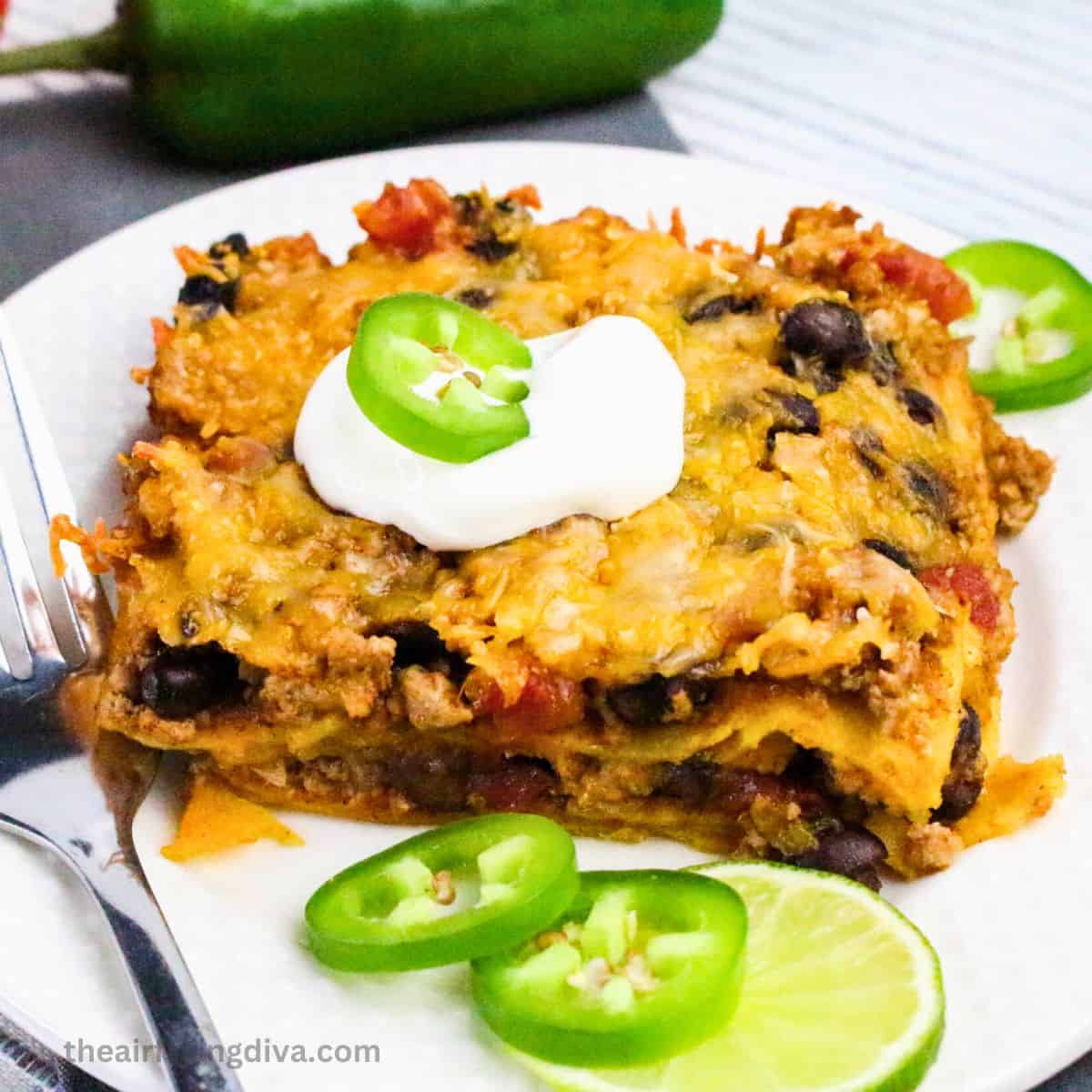 Turkey Enchilada Casserole, a simple and hearty dinner recipe made with ground turkey, beans and enchilada sauce.