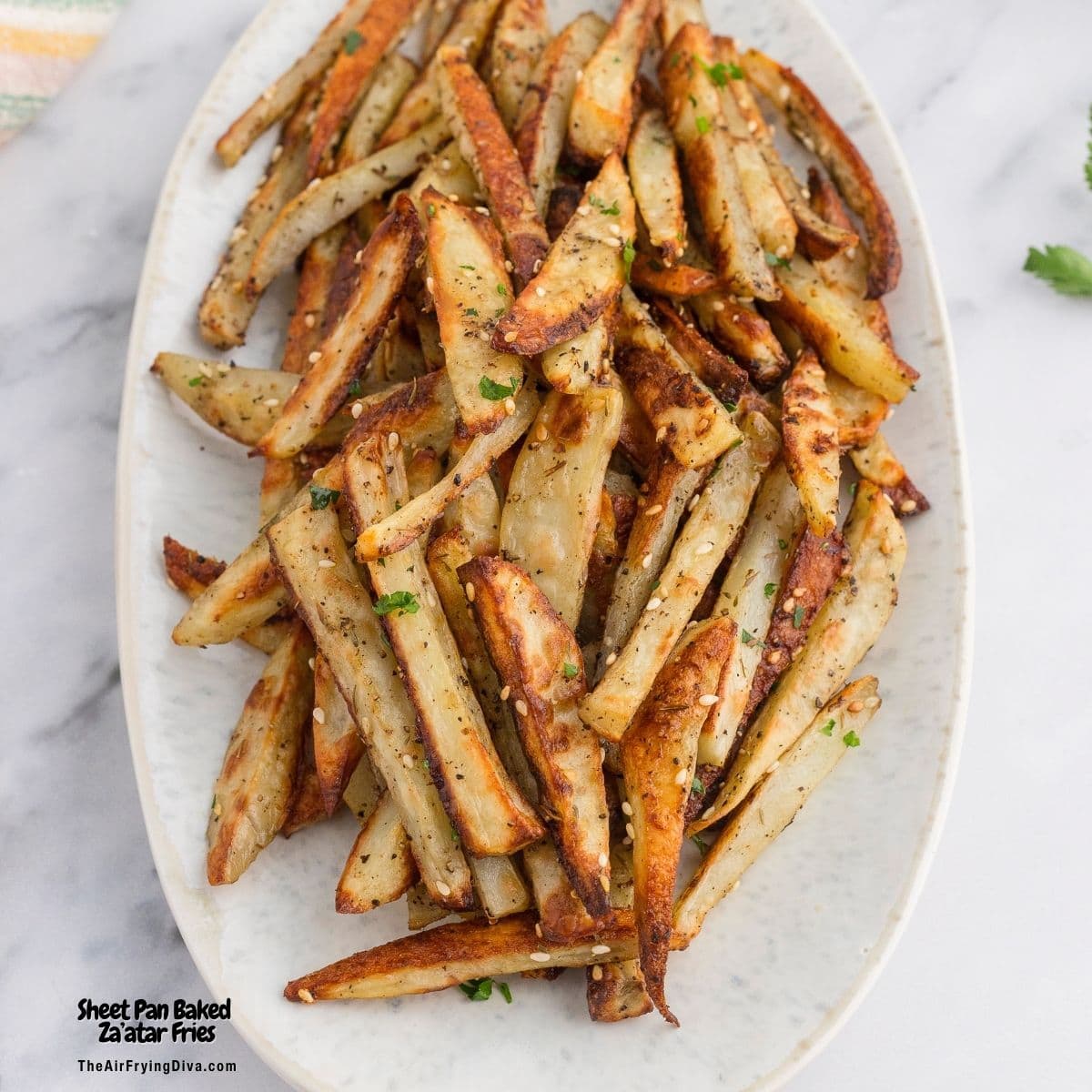 Sheet Pan Baked Za’atar Fries, crispy and flavorful homemade French Fries seasoned with savory Za'atar seasoning blend. Sheet Pan Baked Za’atar Fries, crispy and flavorful homemade French Fries seasoned with savory Za'atar seasoning blend.