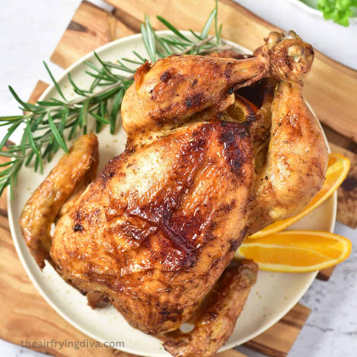 Air Fryer Whole Chicken Recipe, a simple and delicious recipe for moist and flavorful chicken with a crispy outside. Air Fryer Whole Chicken Recipe, a simple and delicious recipe for moist and flavorful chicken with a crispy outside.