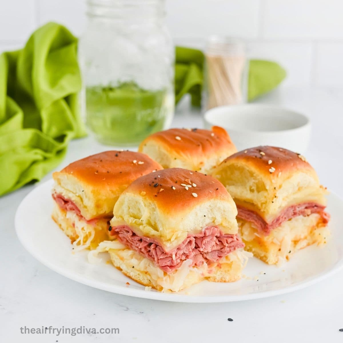 Gooey Oven Baked Reuben Sliders are the ultimate party snack! Layers of tender corned beef, Swiss cheese, and sauerkraut on Hawaiian rolls. Gooey Oven Baked Reuben Sliders are the ultimate party snack! Layers of tender corned beef, Swiss cheese, and sauerkraut on Hawaiian rolls.