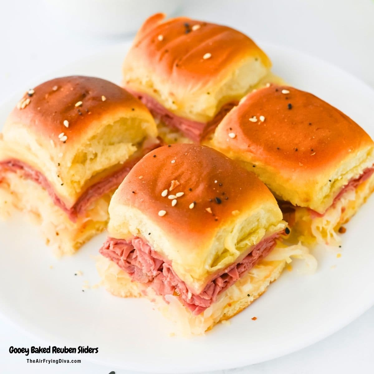 Gooey Oven Baked Reuben Sliders are the ultimate party snack! Layers of tender corned beef, Swiss cheese, and sauerkraut on Hawaiian rolls. Gooey Oven Baked Reuben Sliders are the ultimate party snack! Layers of tender corned beef, Swiss cheese, and sauerkraut on Hawaiian rolls.