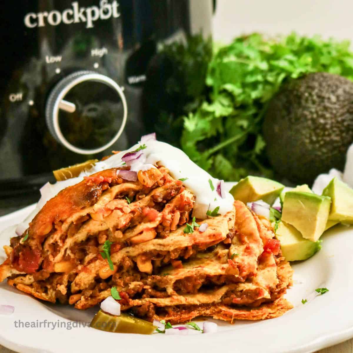 Easy Crock Pot Taco Casserole, a recipe for Cheesy Taco Lasagna with Tortillas, seasoned beef, beans, corn, and melty cheese. Easy Crock Pot Taco Casserole, a recipe for Cheesy Taco Lasagna with Tortillas, seasoned beef, beans, corn, and melty cheese.